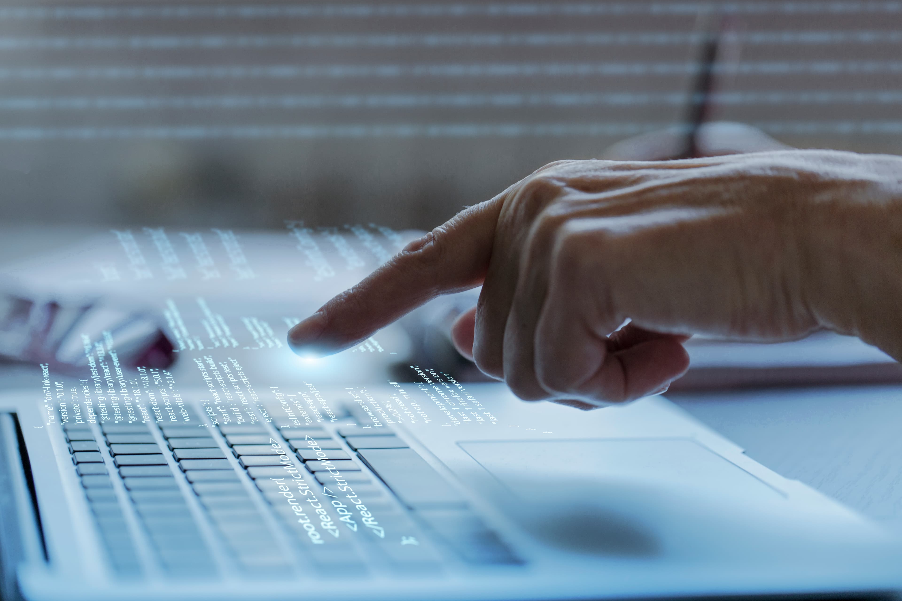 Cybersecurity expert working on a laptop
