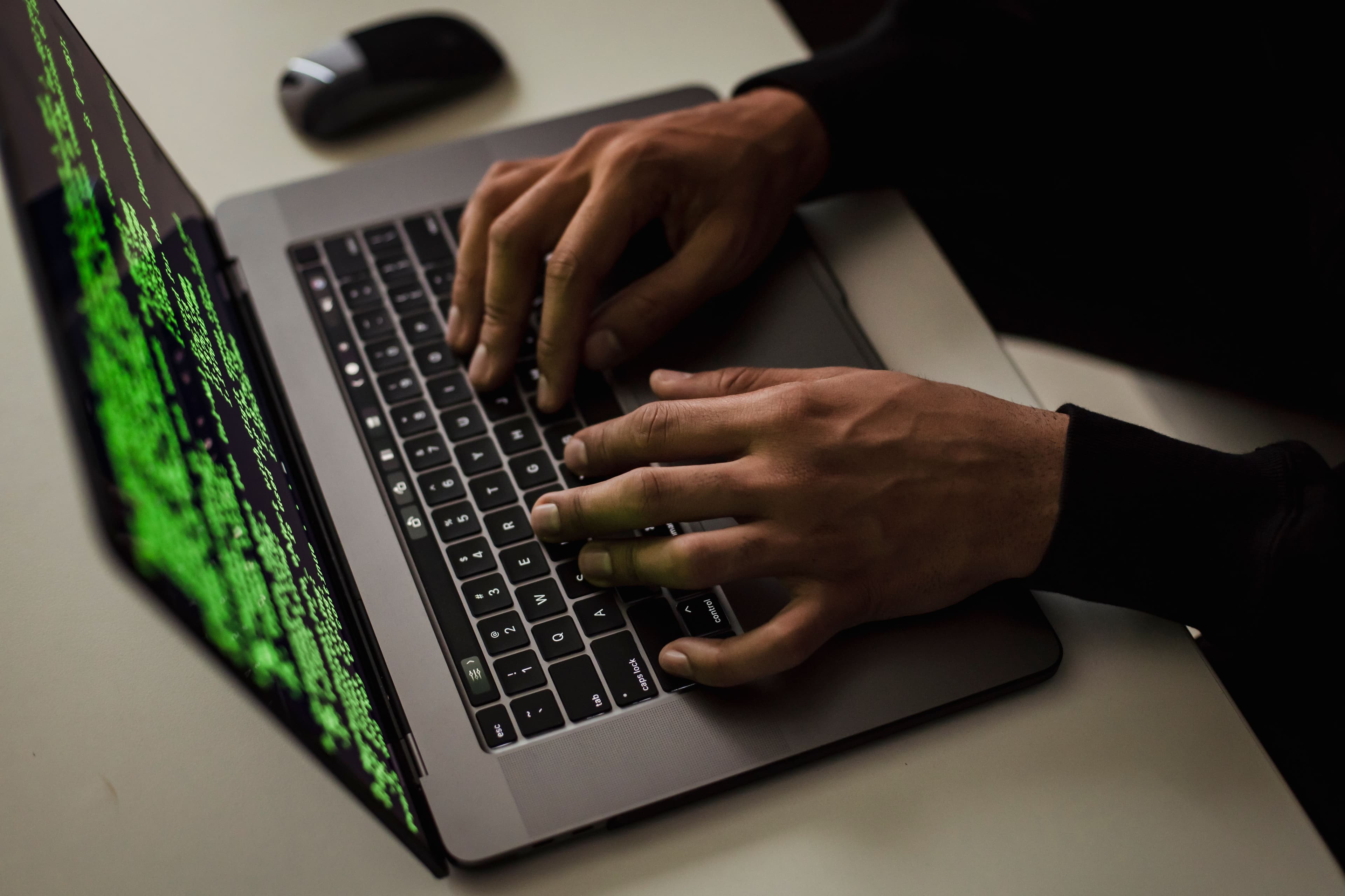 Cybersecurity expert working on a laptop