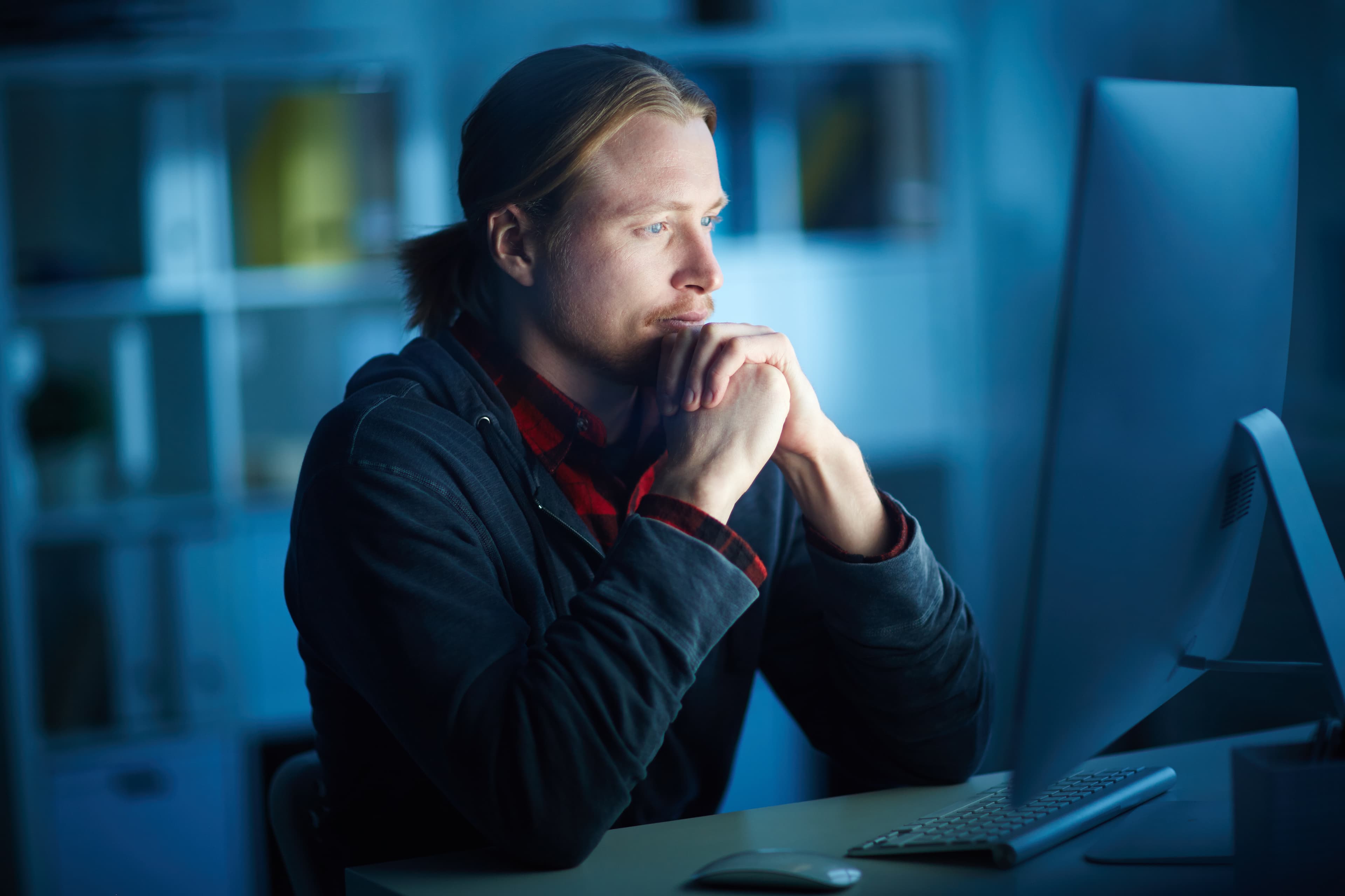 Cybersecurity expert analysing data on a screen
